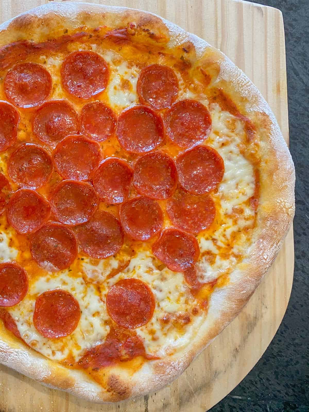 homemade pizza on a pizza peel