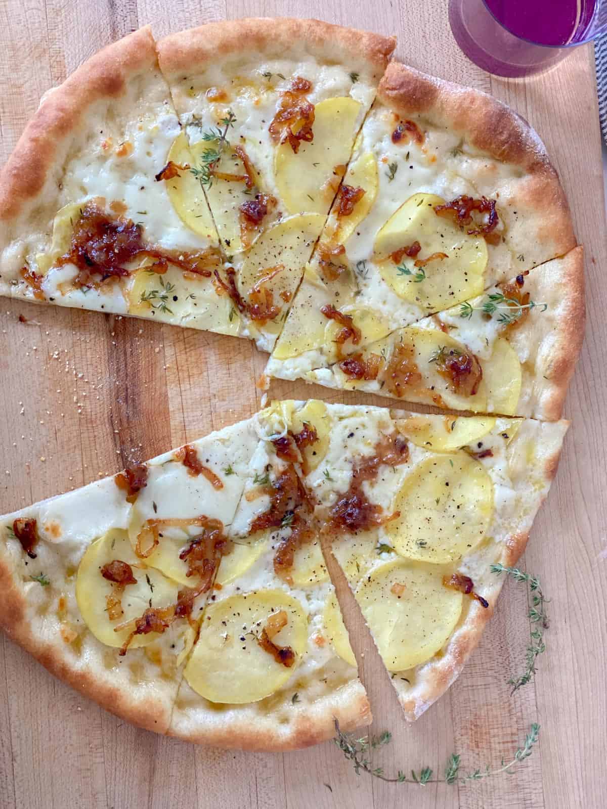 pizza toppings list with a glass of rose
