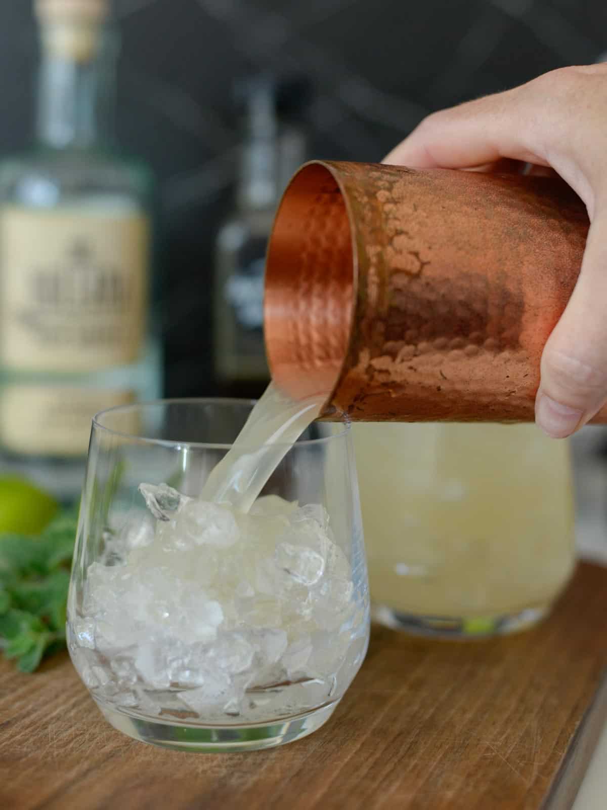 Mai Tai Recipe being poured over ice in an double old fashioned glass