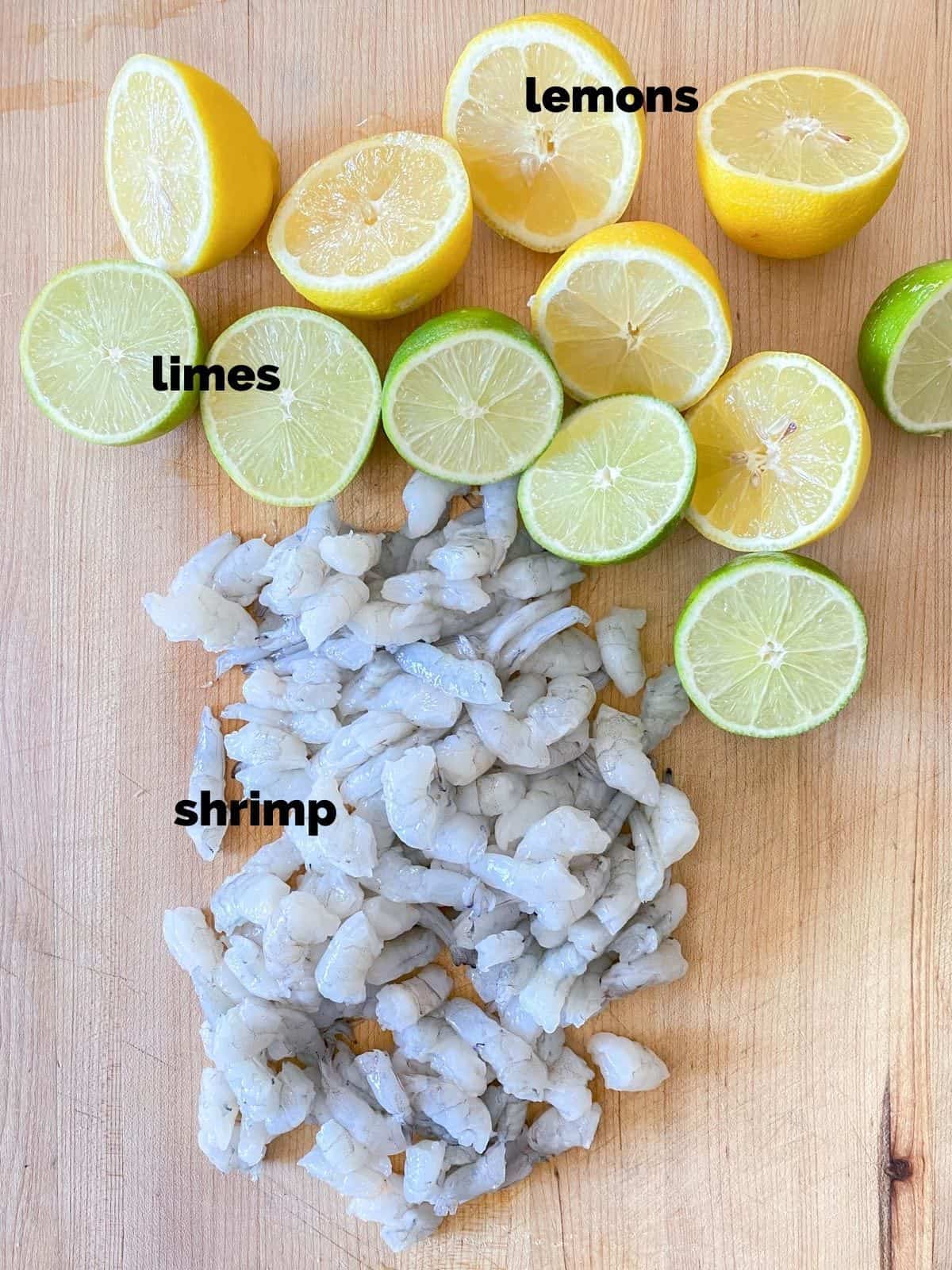 raw shrimp, limes and lemons for making ceviche