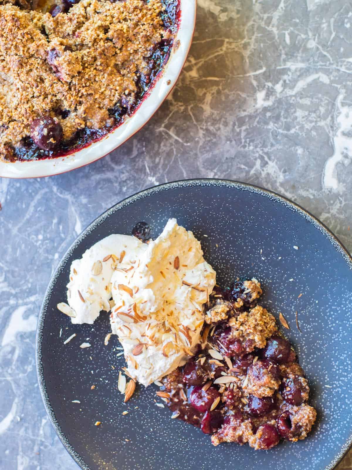 cherry crumble made with fresh cherries and a gluten free almond crumble topping