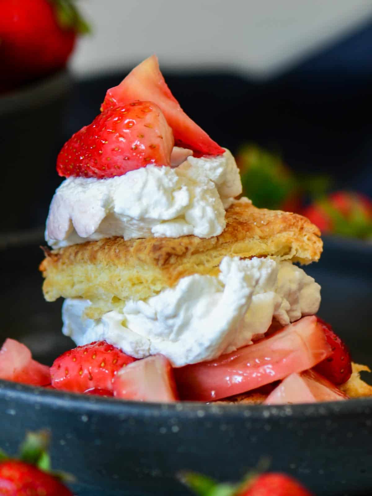 Homemade strawberry shortcake served with freshly whipped cream.