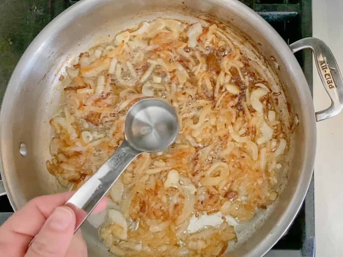 Add a little water or vinegar to deglaze the pan