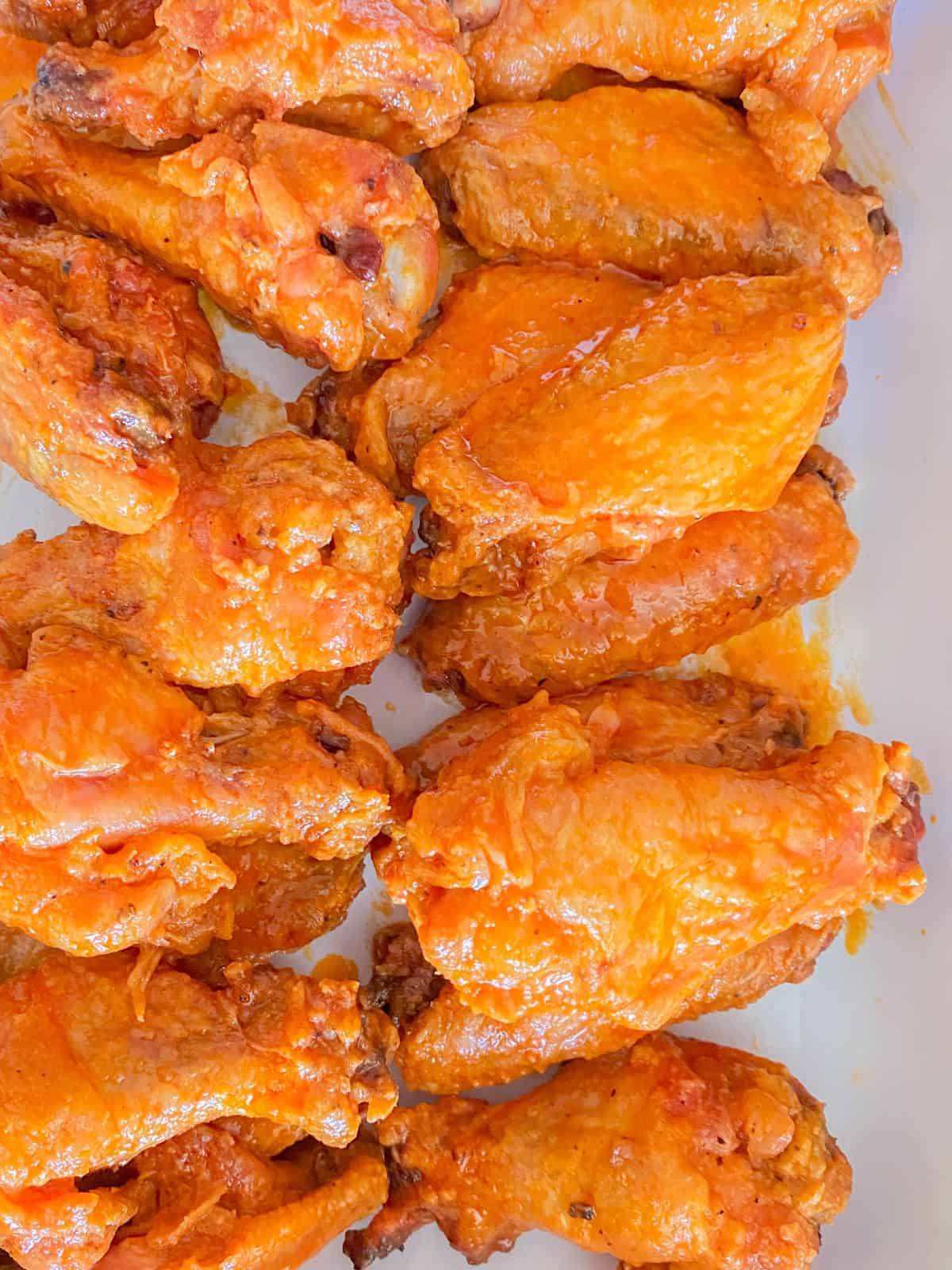 buffalo hot wings in a white dish