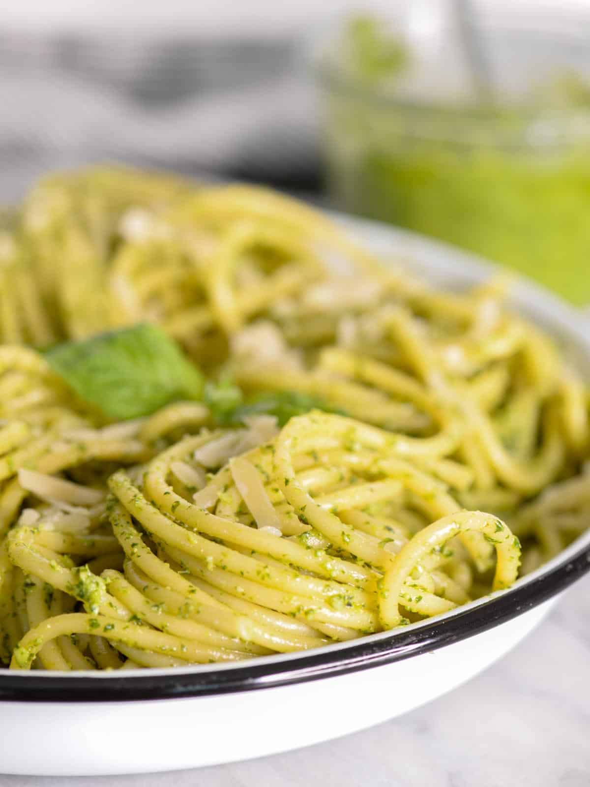 a bowl of pasta with homemade pesto sauce