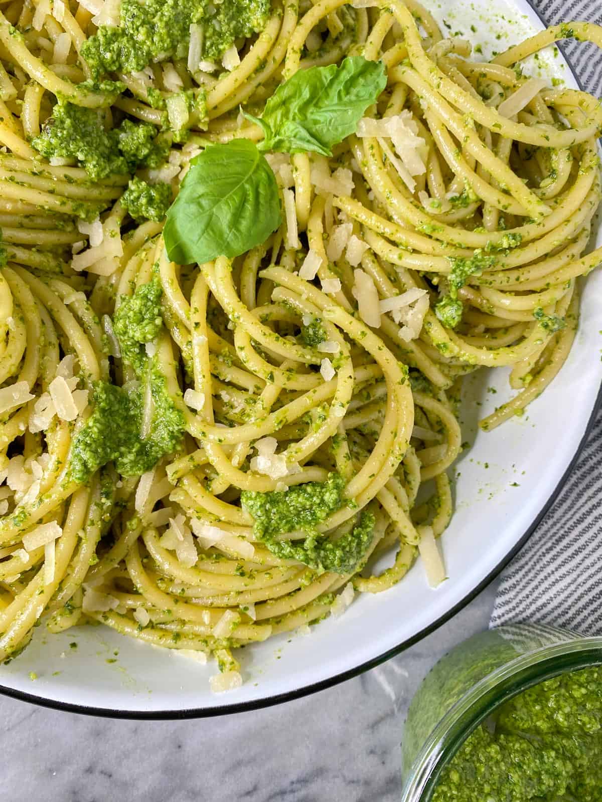 a serving dish with fresh homemade pesto recipe