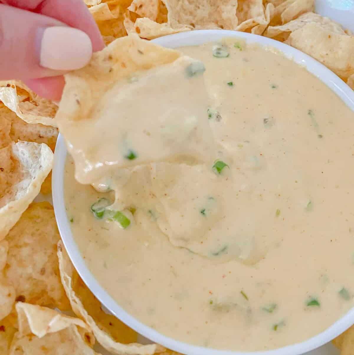 white cheese queso dip served with tostitos scoops