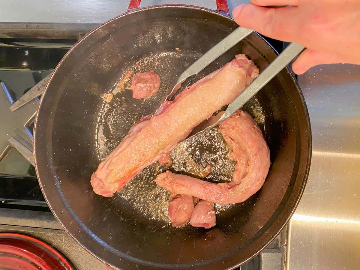 turkey neck and giblets browning to make homemade turkey stock