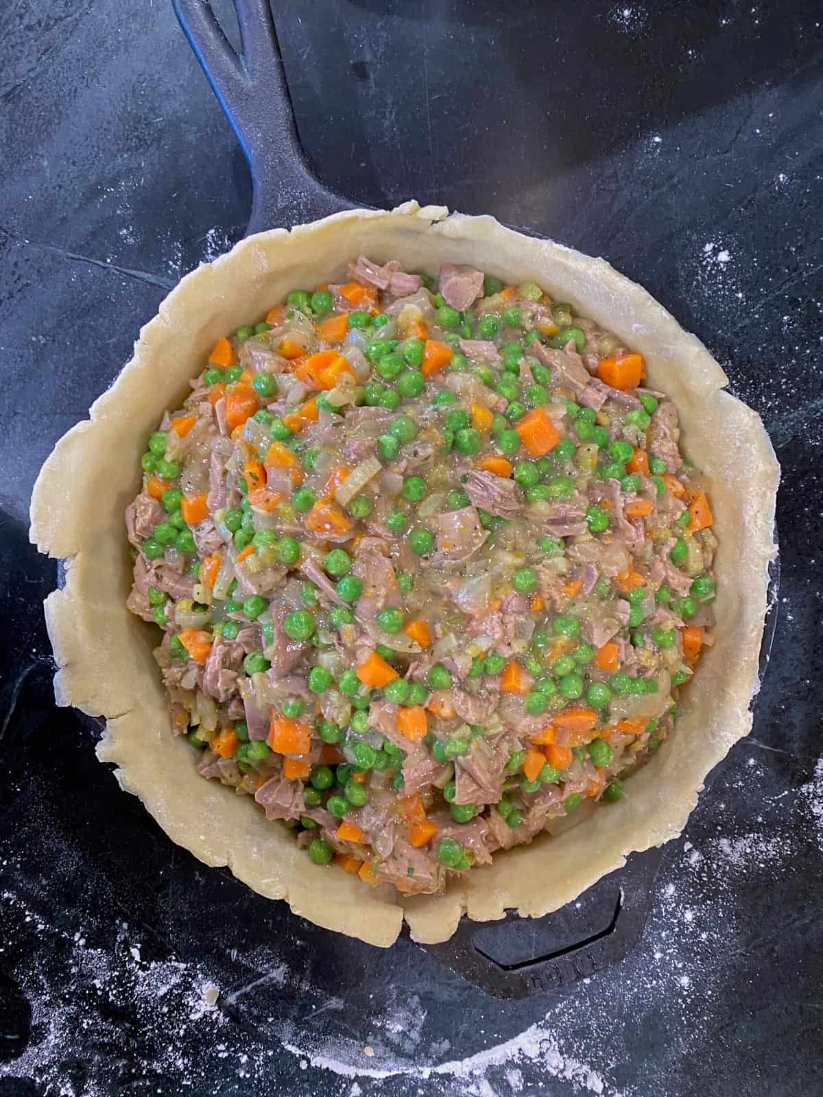 add the trukey pot pie filling to the pan