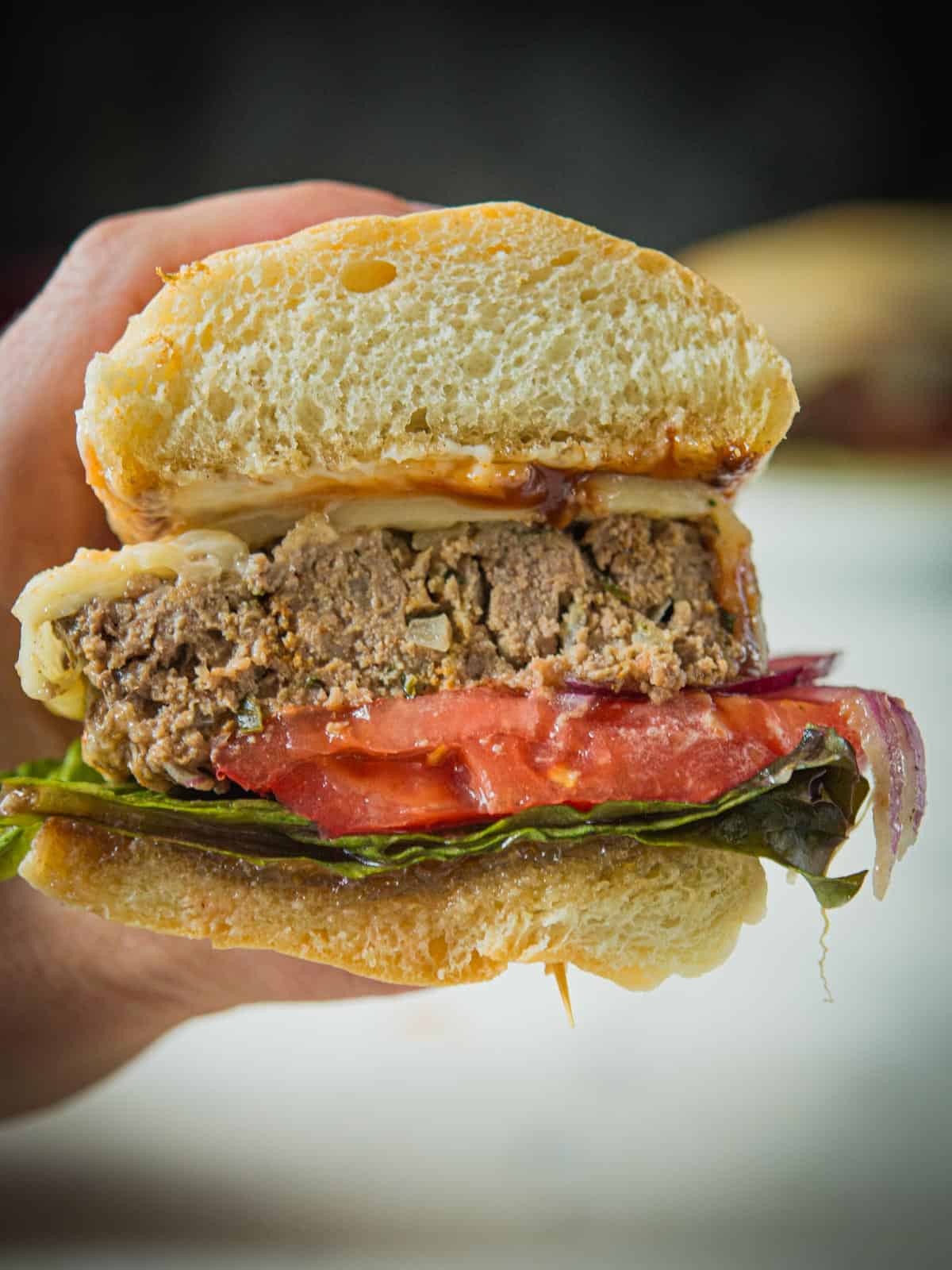 Inside of a meatloaf sandwich.