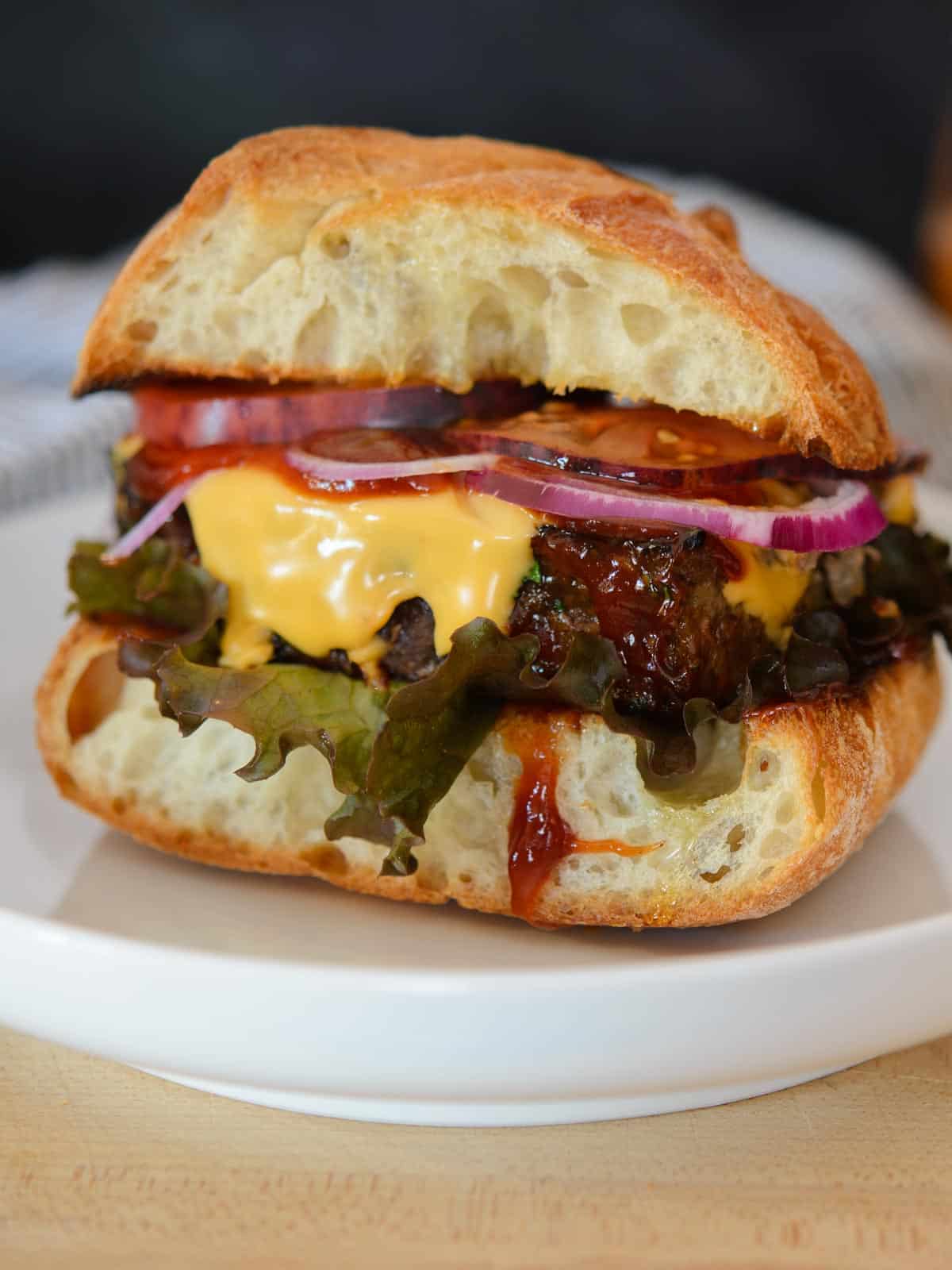 Tender and juicy meatloaf with melted cheese and meatloaf sauce. 