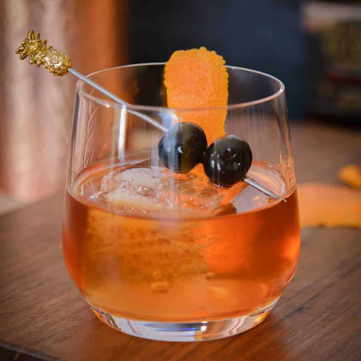 An old fashioned cocktail with luxardo cherries