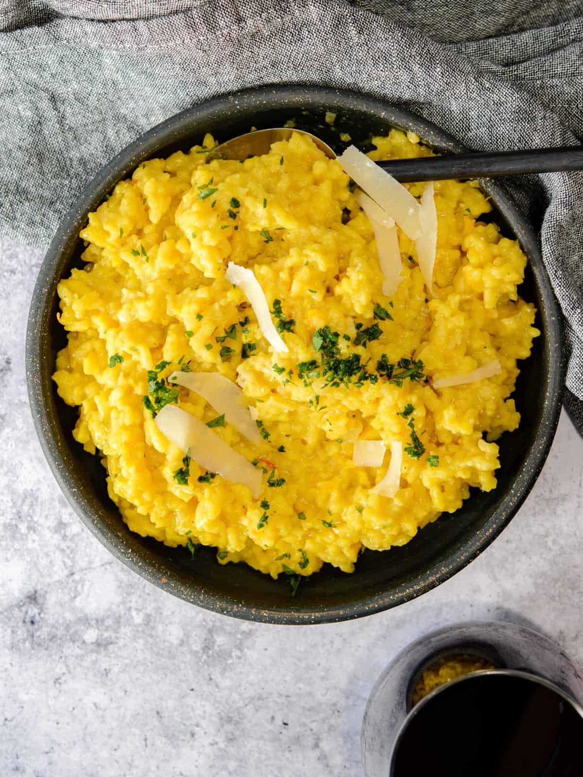 risotto served with a glass of wine