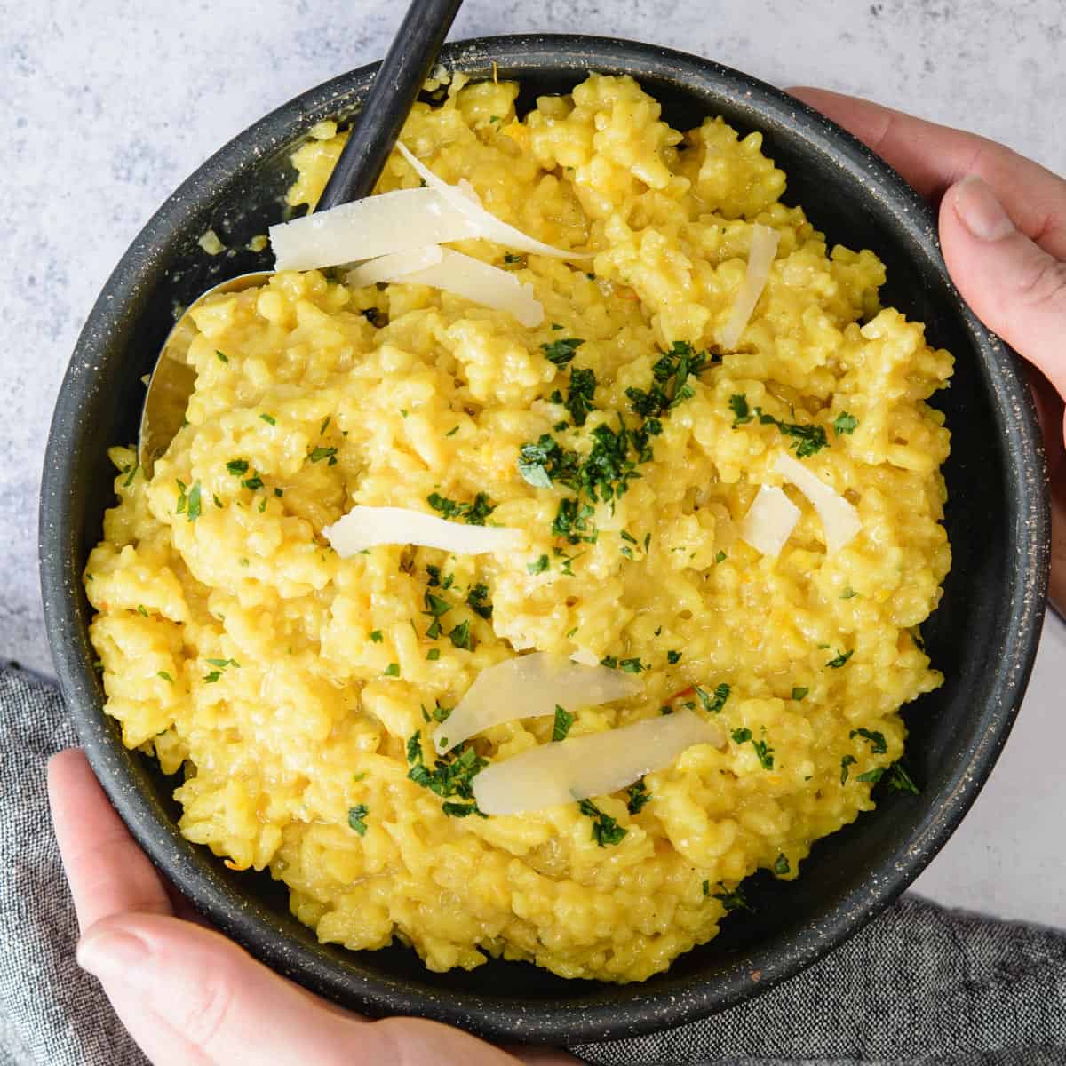 risotto recipe garnished with parmesan and parsley