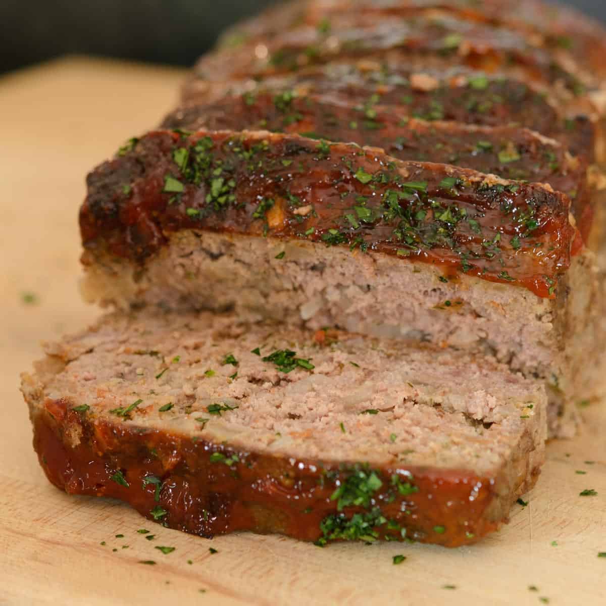 sliced meatloaf on a cutting board