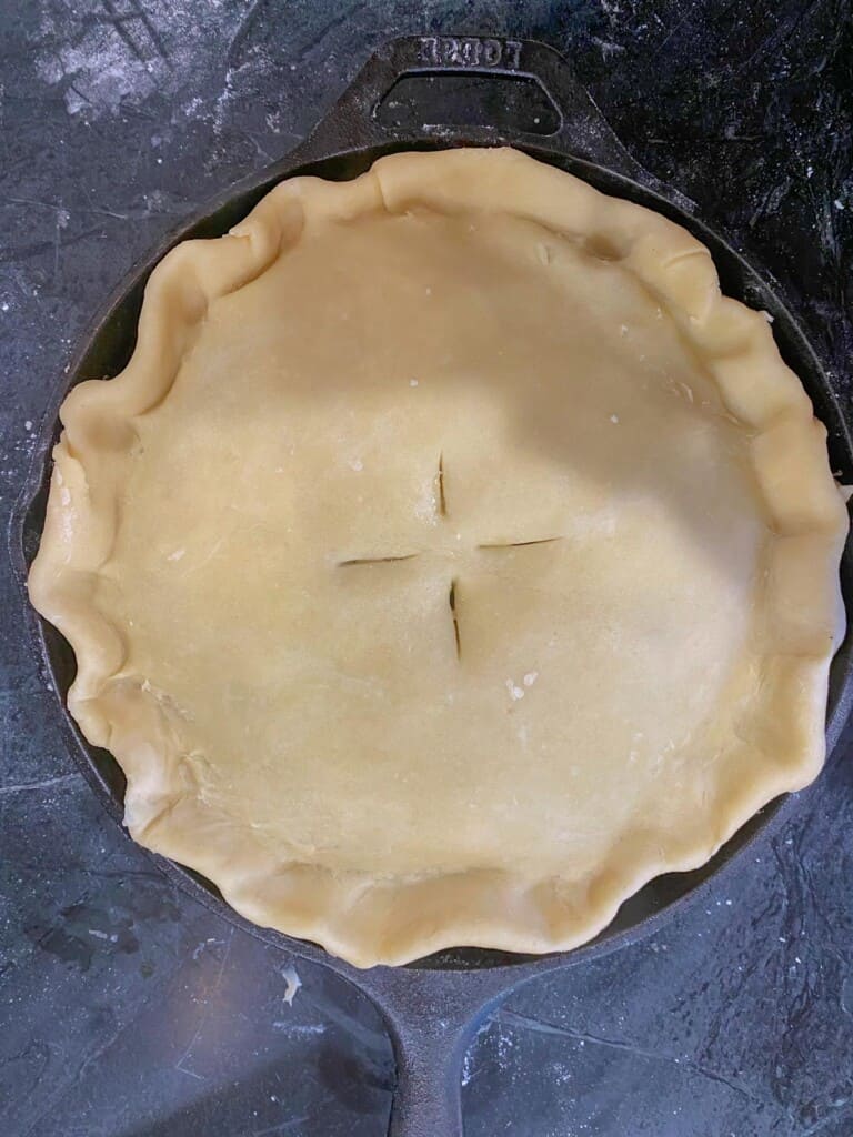 with a sharp knife vent the top of the pie dough