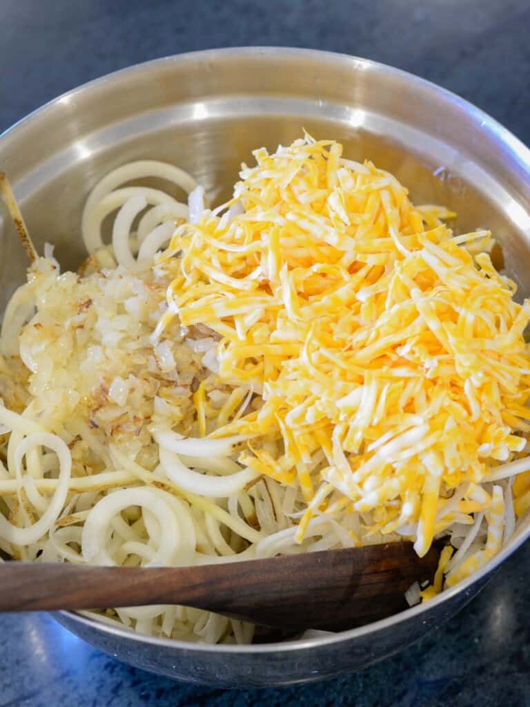 add the shredded cheese