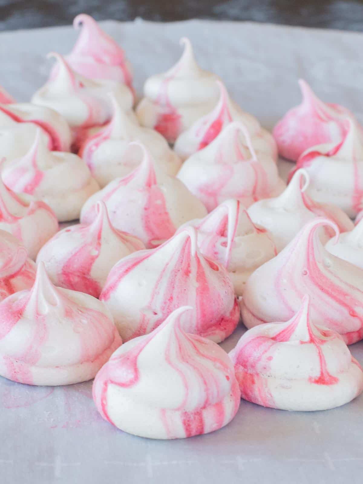 peppermint meringues on parchment paper