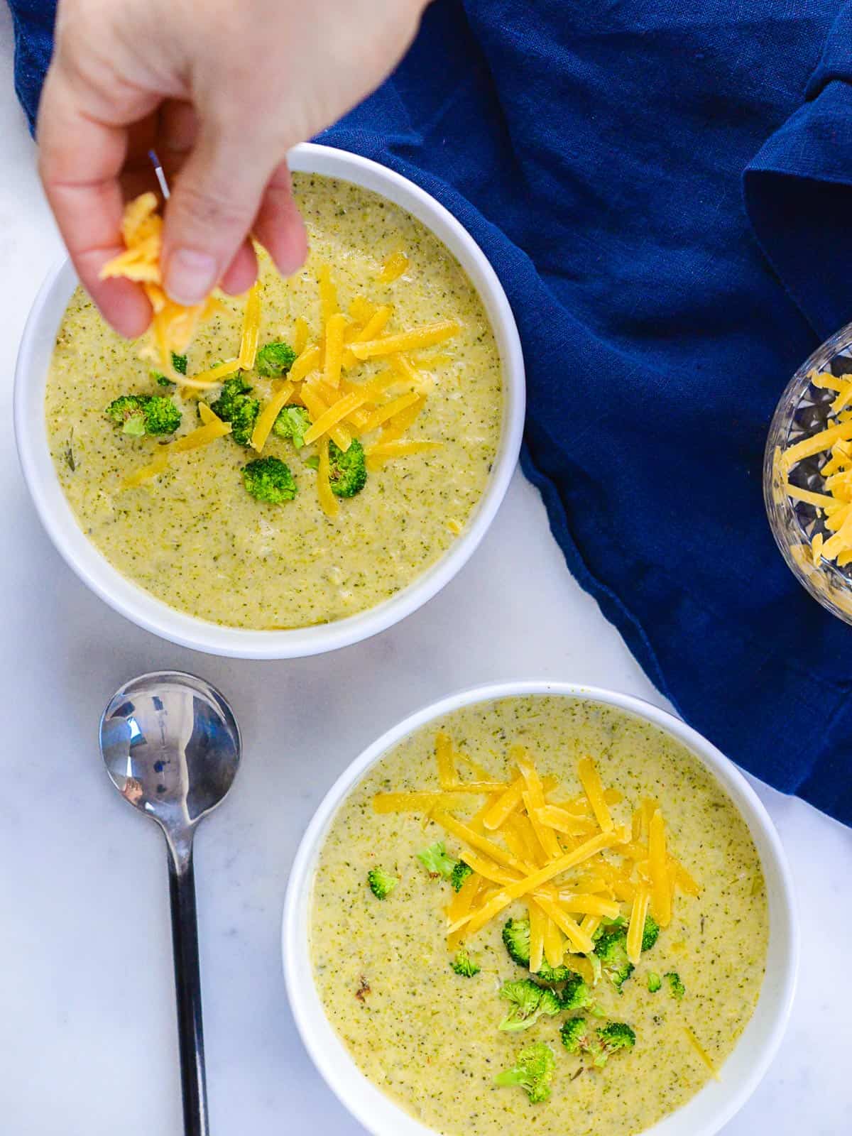 shredded cheddar on broccoli soup