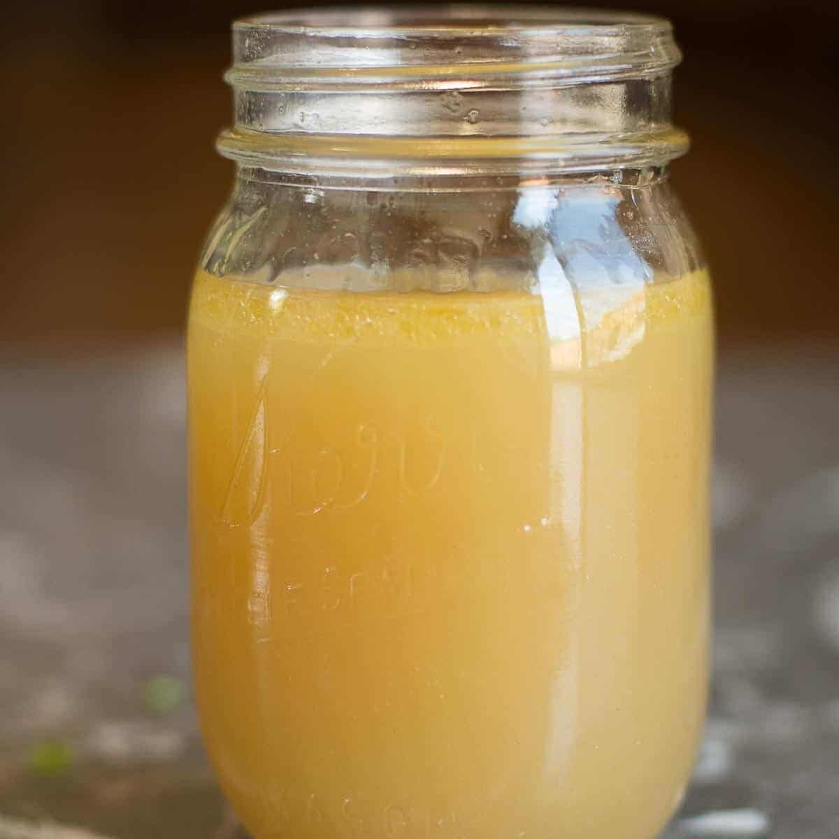 homemade chicken bone broth recipe. store in a mason jar