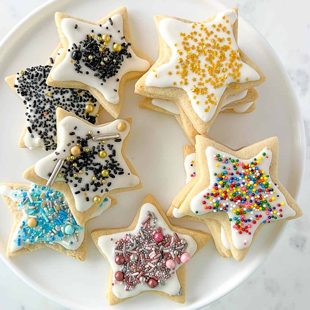 https://www.foodologygeek.com/wp-content/uploads/2022/01/iced-rolled-out-sugar-cookies-recipe.jpg