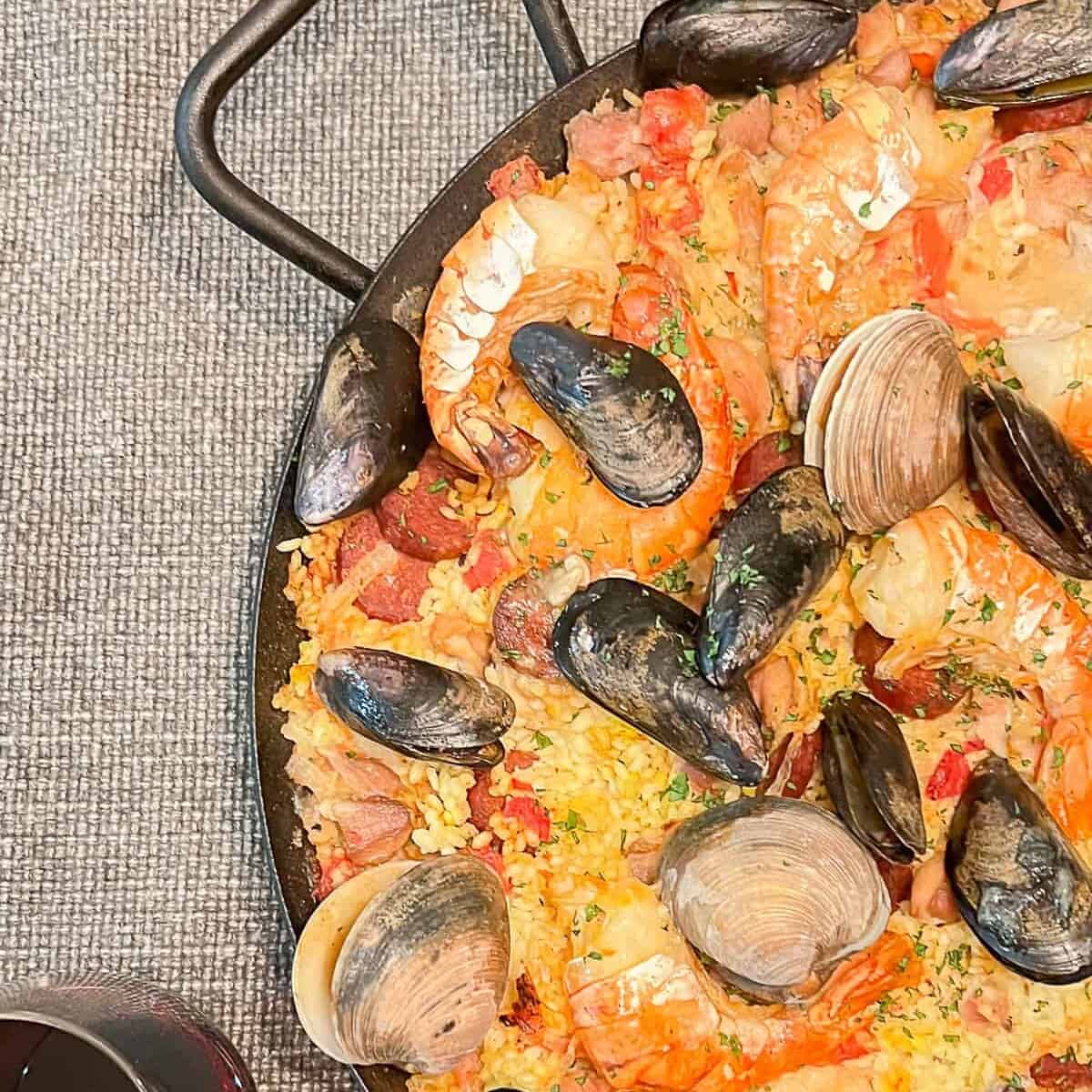 spanish paella recipe in a cast iron pan