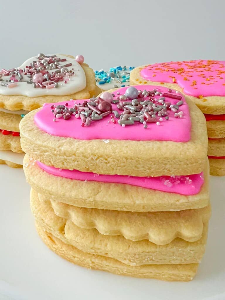stack of cut out sugar cookies