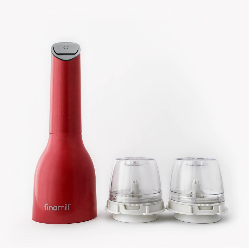 finamill red spice grinder and pod system pictured with 2 spice pods