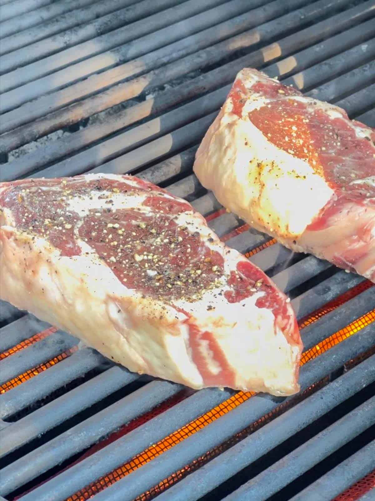 add the steaks to a hot grill