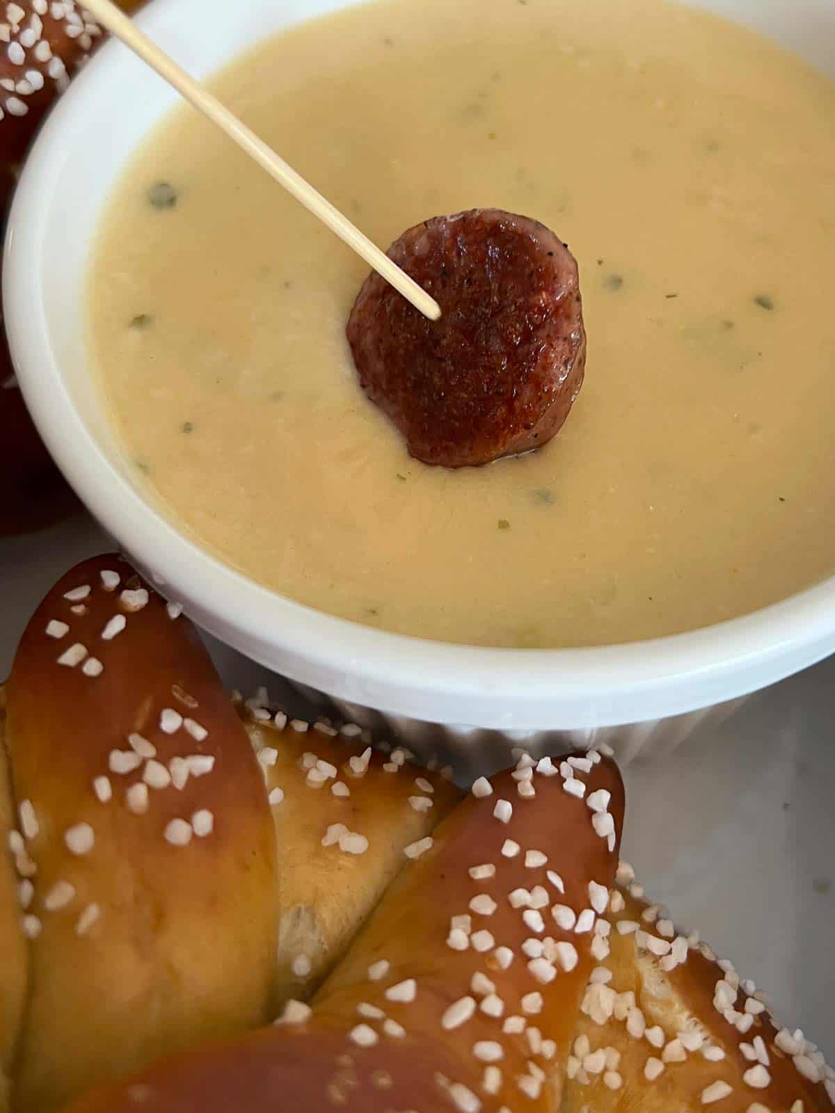 beer cheese served with browned bratwurst sausage