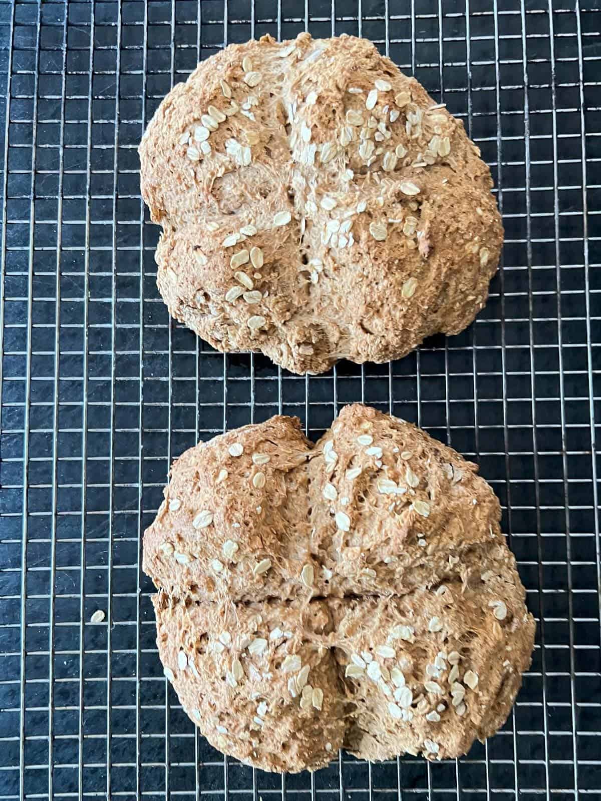 loaves of bread cooling on a wire rack