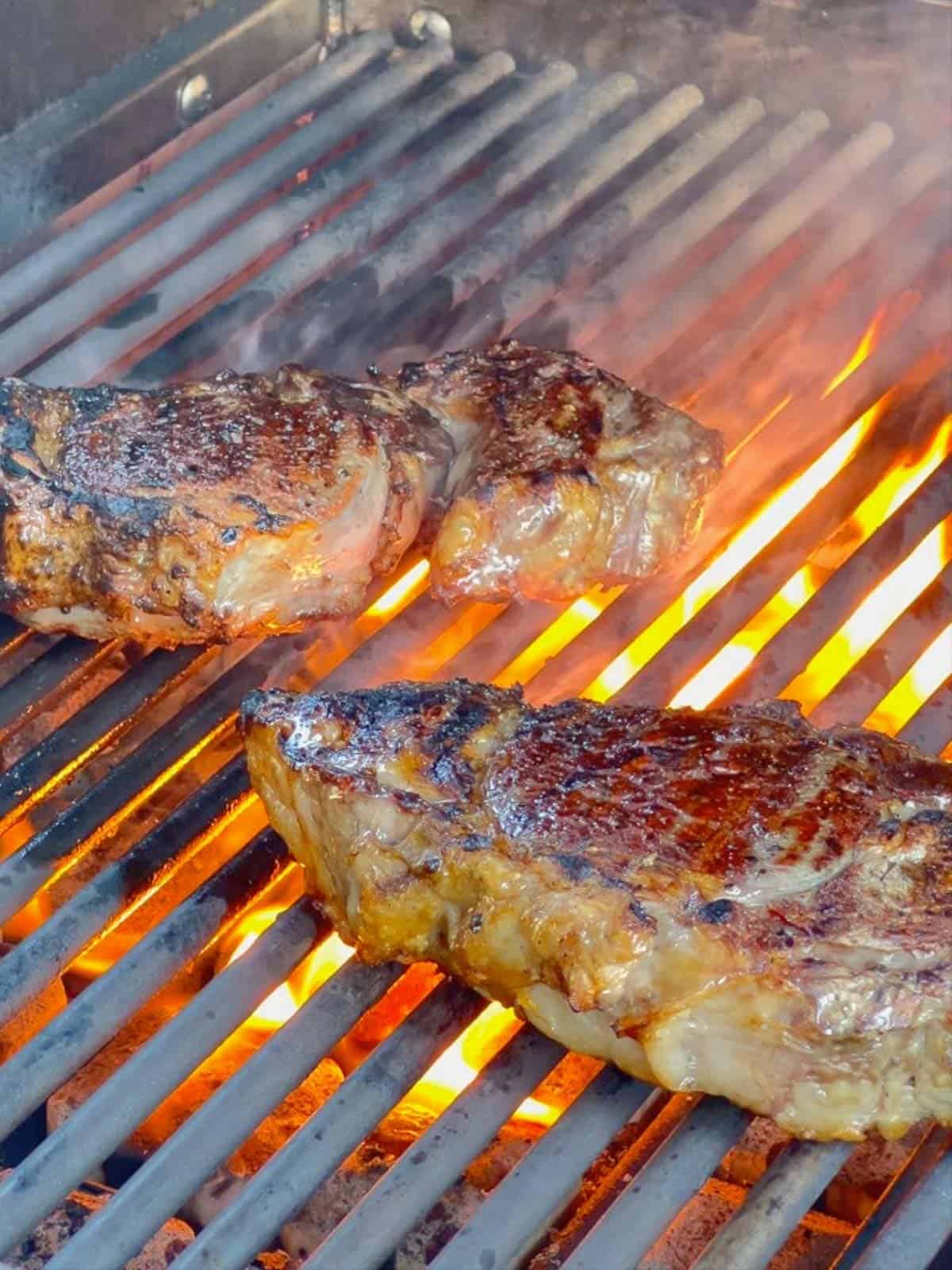 grilled steaks ready to come off the grill