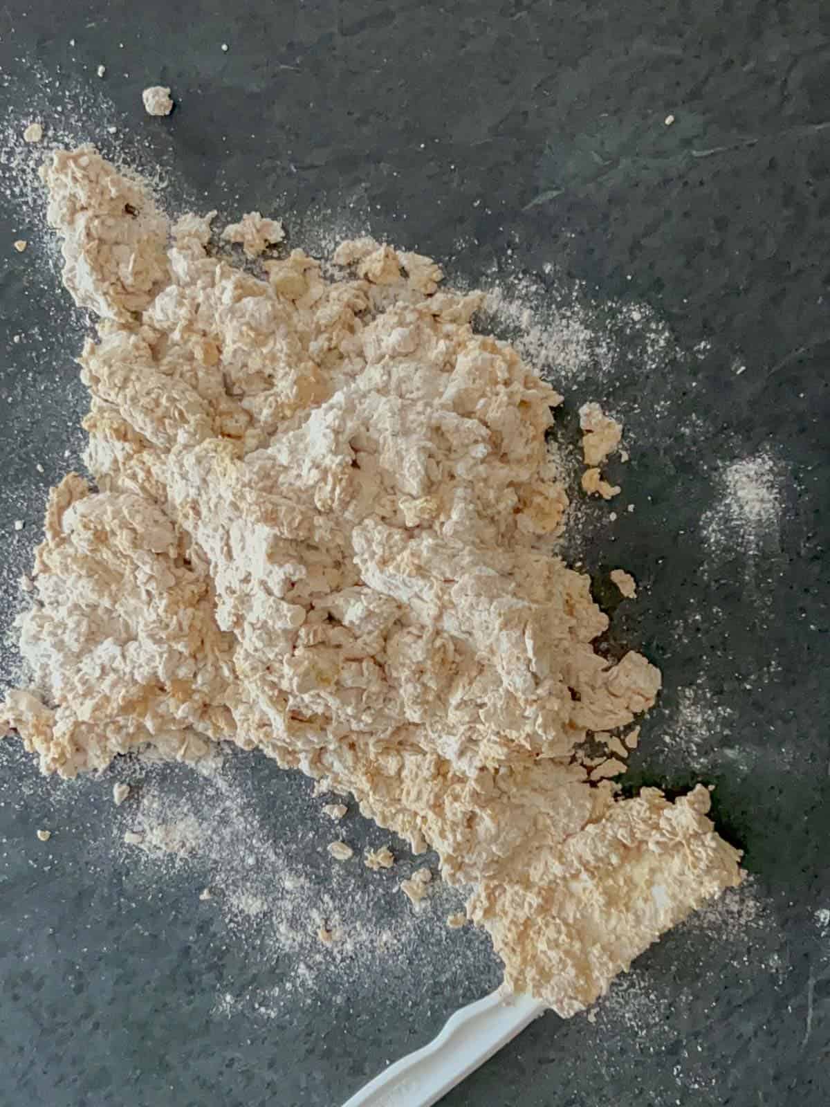 mix the dough with a large spatula. Turn out onto your work surface and knead.