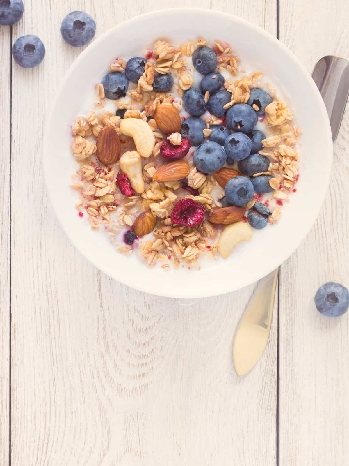 granola with almond milk and fresh fruit