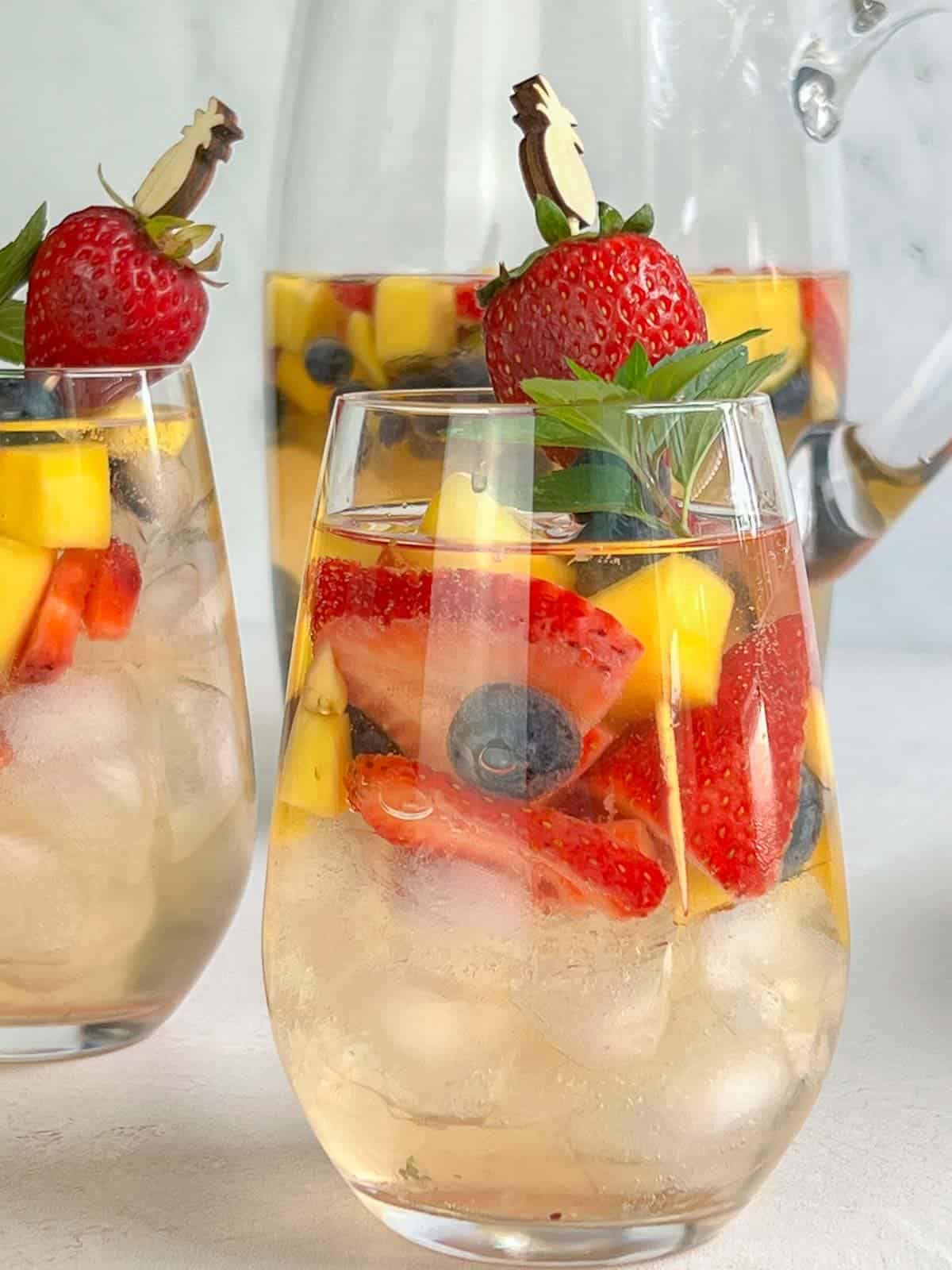 white sangria in stemless wine glasses