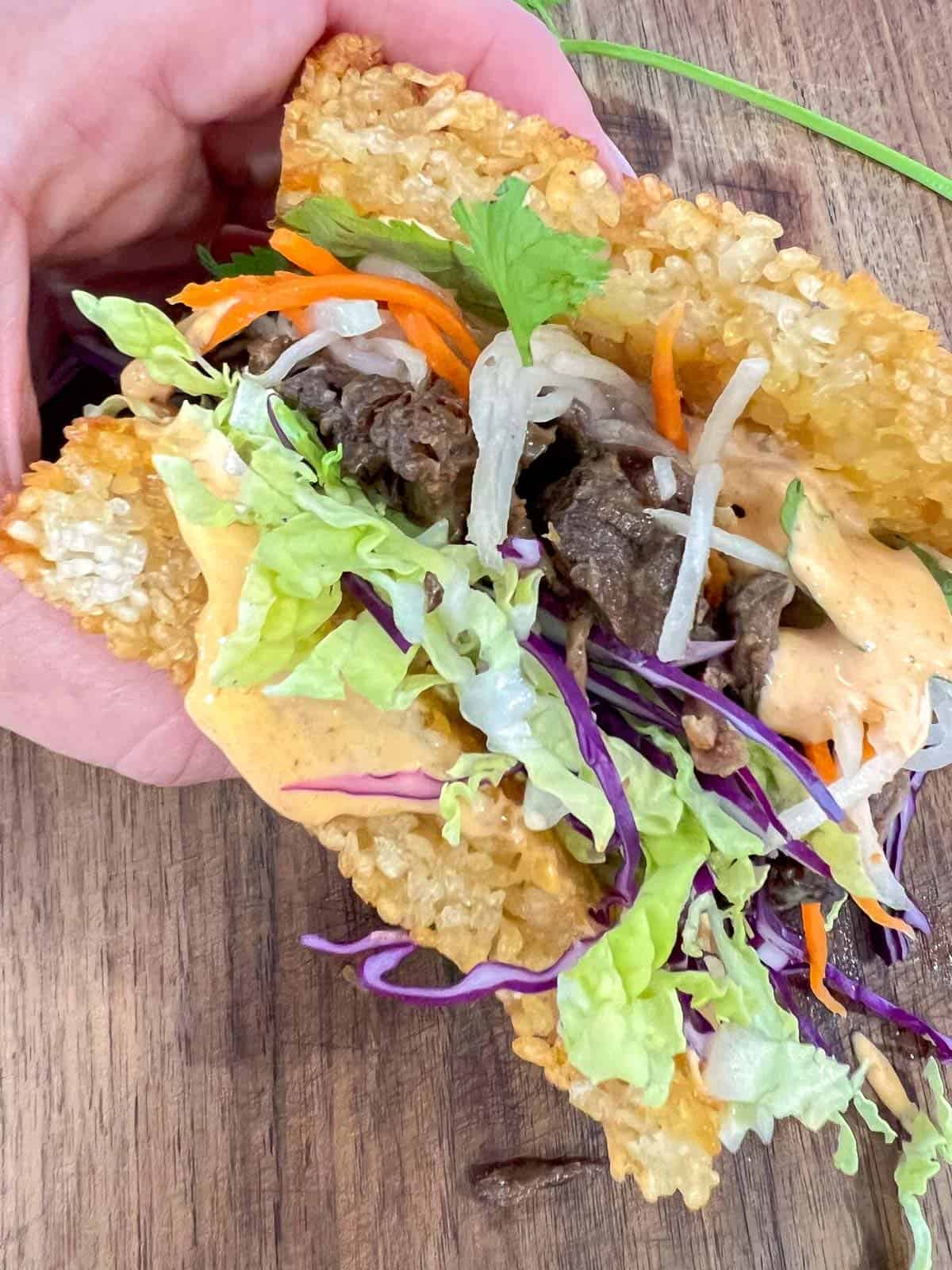 Korean Short rib sandwich served on crispy rice buns. 