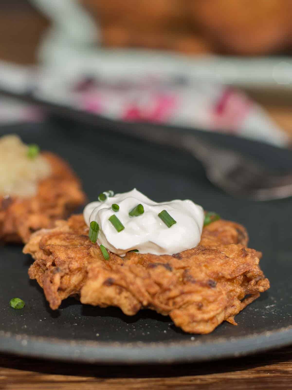 traditional latkes topped with sour cream or apple sauce