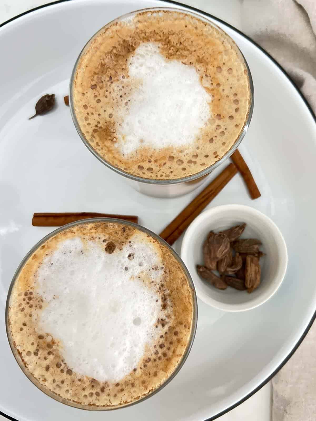 chai latte's served with cinnamon and cardamom