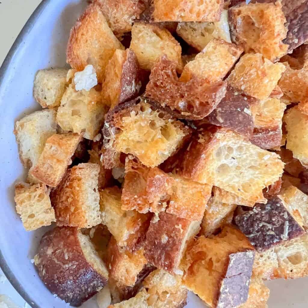 a bowl of freshly baked homemade croutons