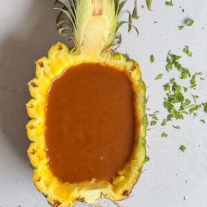 huli huli bbq sauce in a fresh pineapple bowl