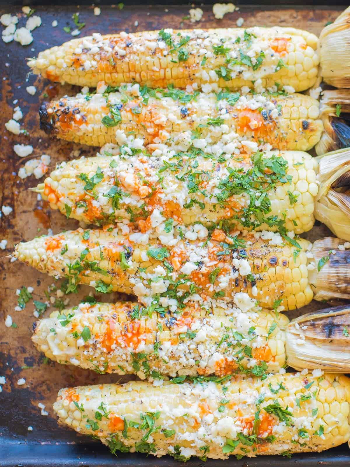 mexican street corn with dressing and cilantro