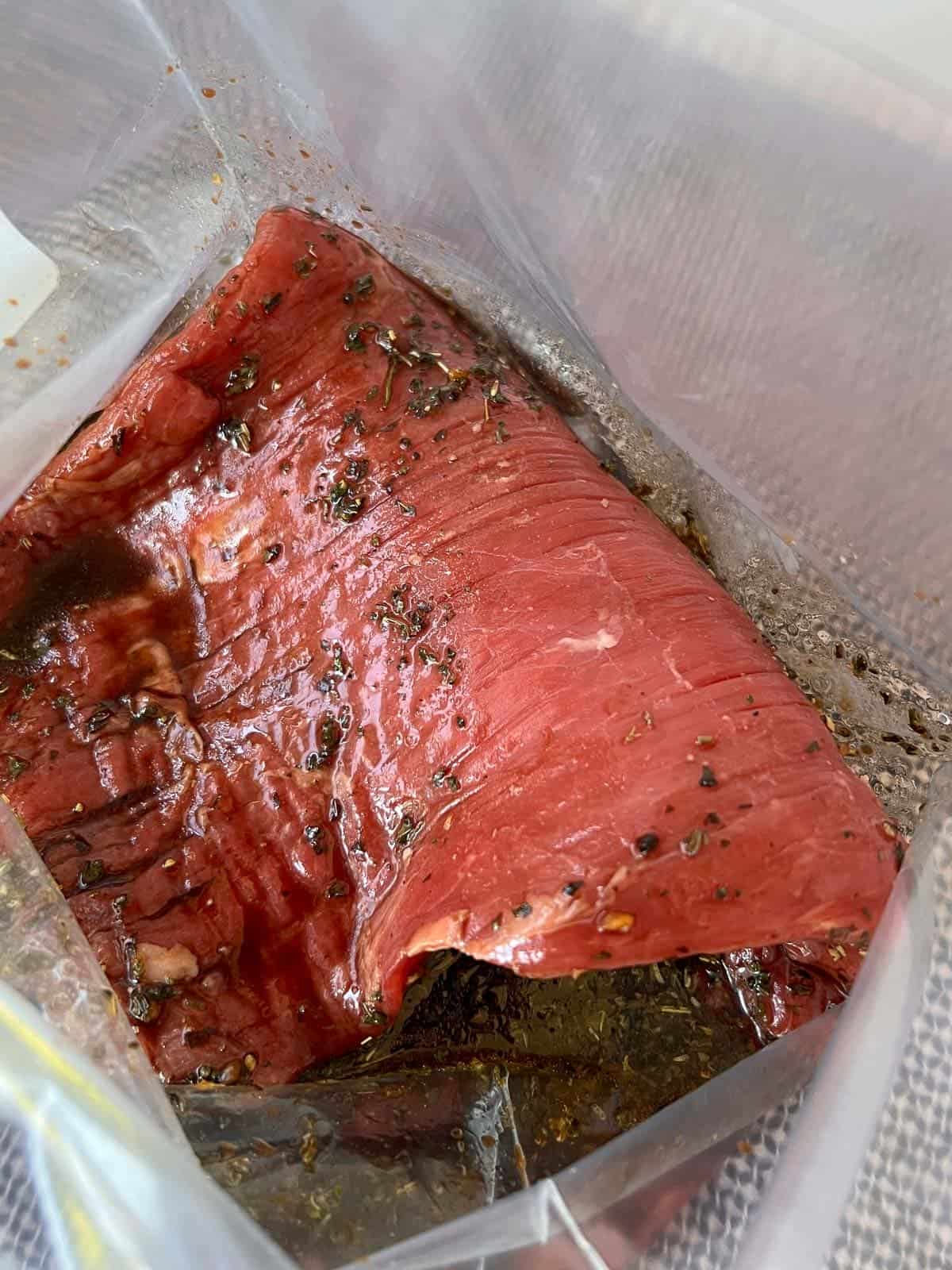 skirt steak marinating in a zip top bag