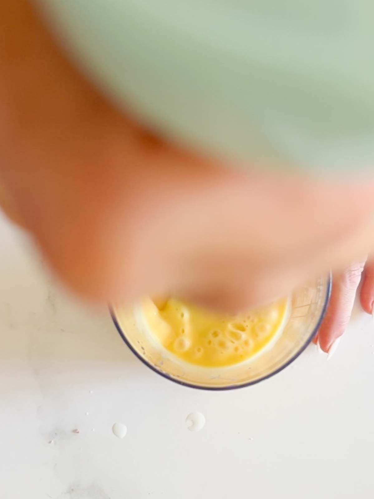 mayonnaise coming to an emulsion in an immersion blender