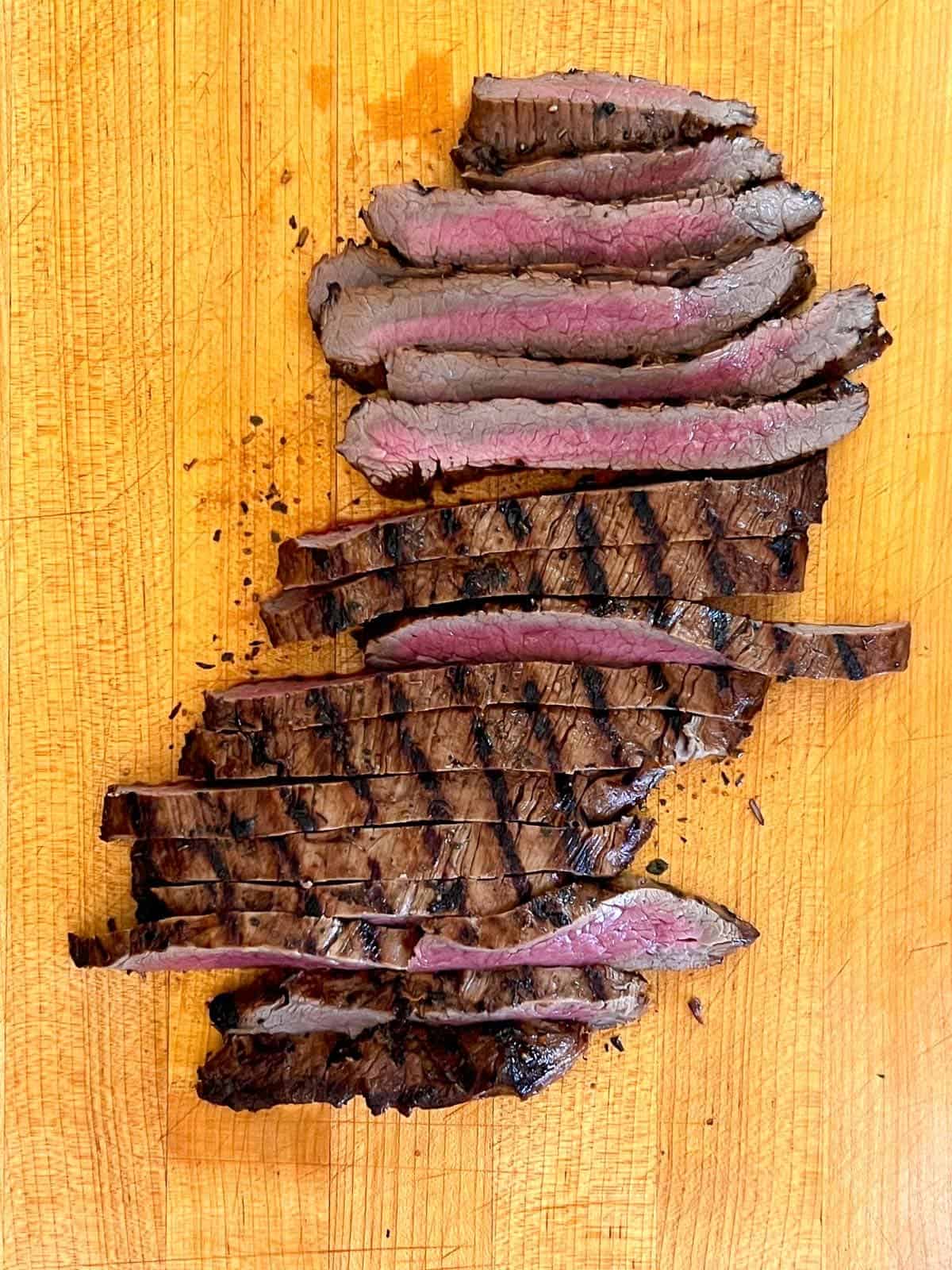 sliced skirt steak on a cutting board