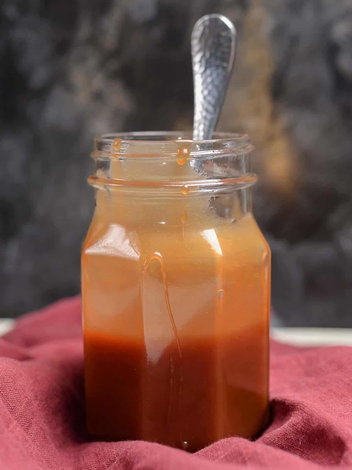 a jar of homemade caramel sauce