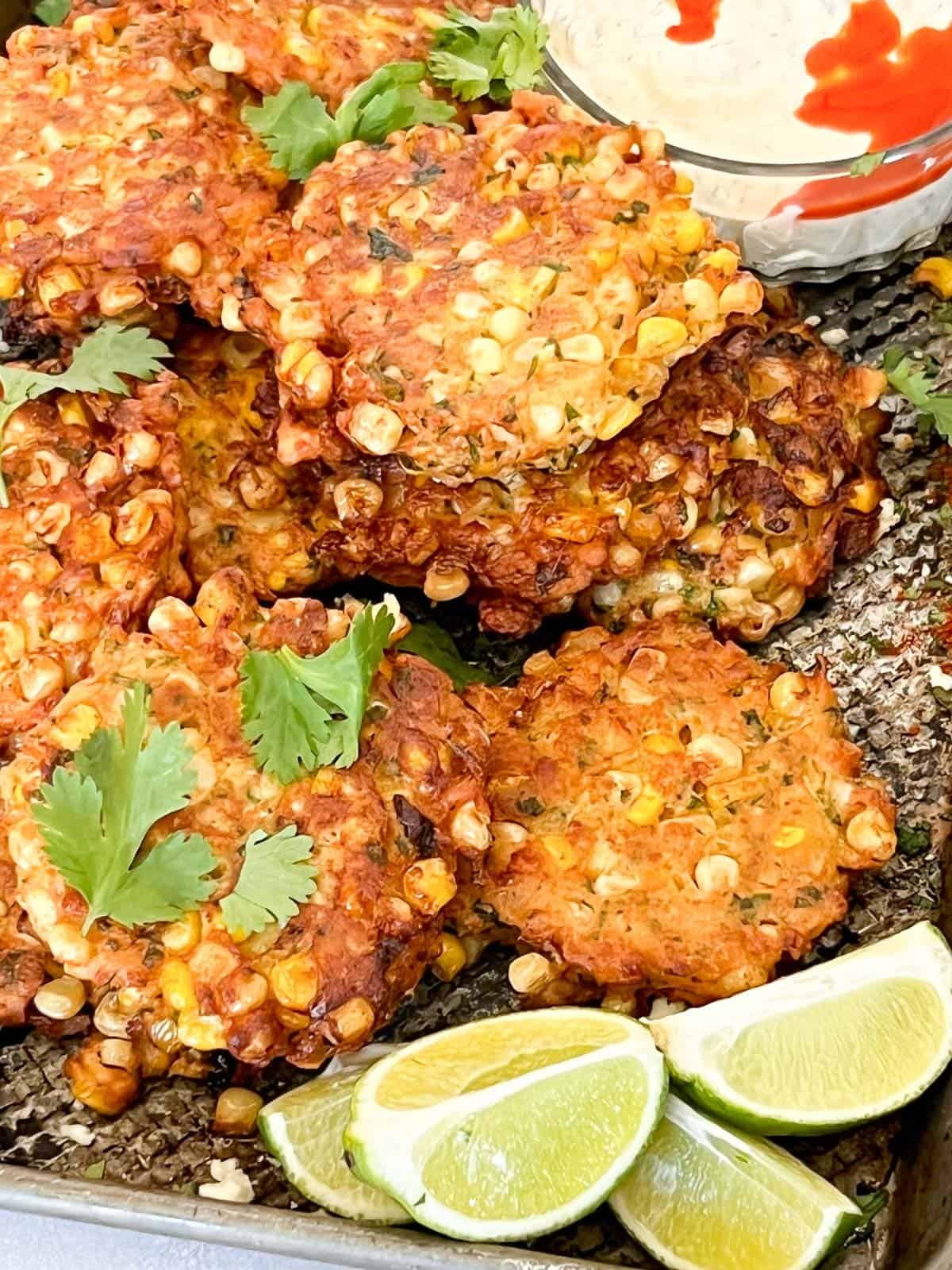 a stack of freshly fried corn fritters