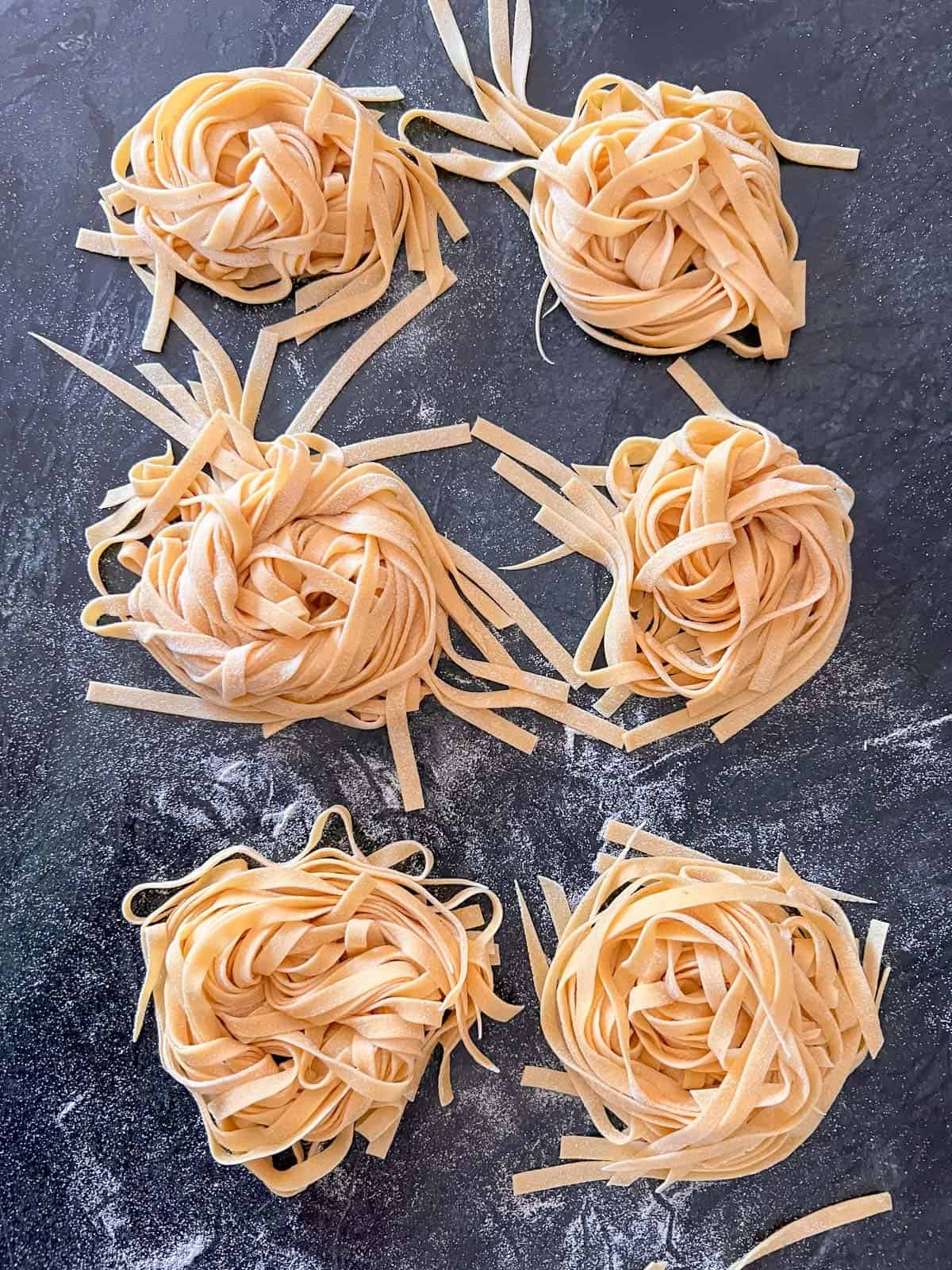 homemade pasta drying in nests