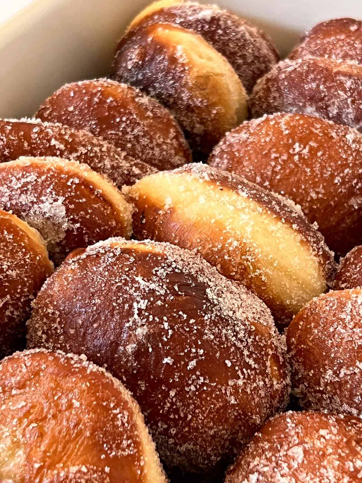 fresh homemade malasadas tossed in sugar