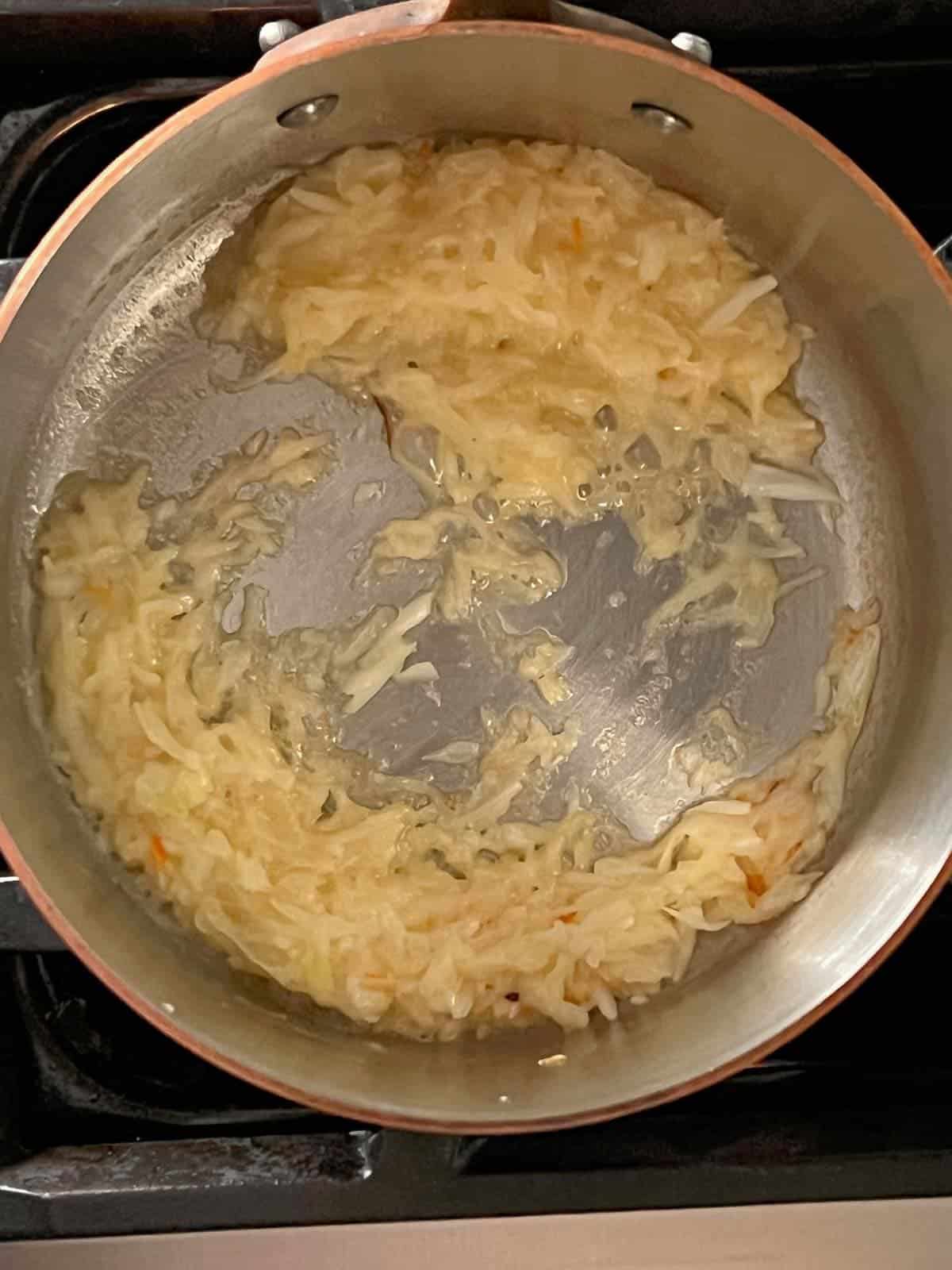 onions caramelizing in butter for homemade bbq sauce