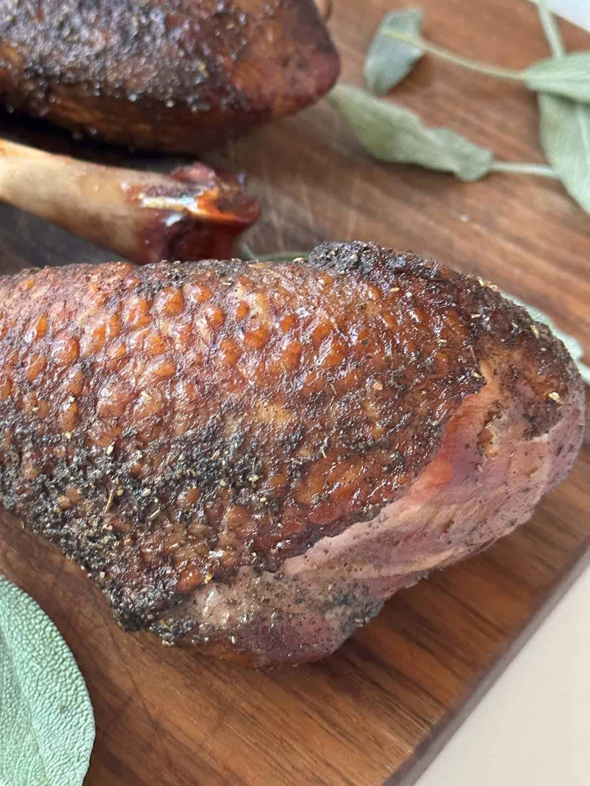 smoked turkey legs on a cutting board